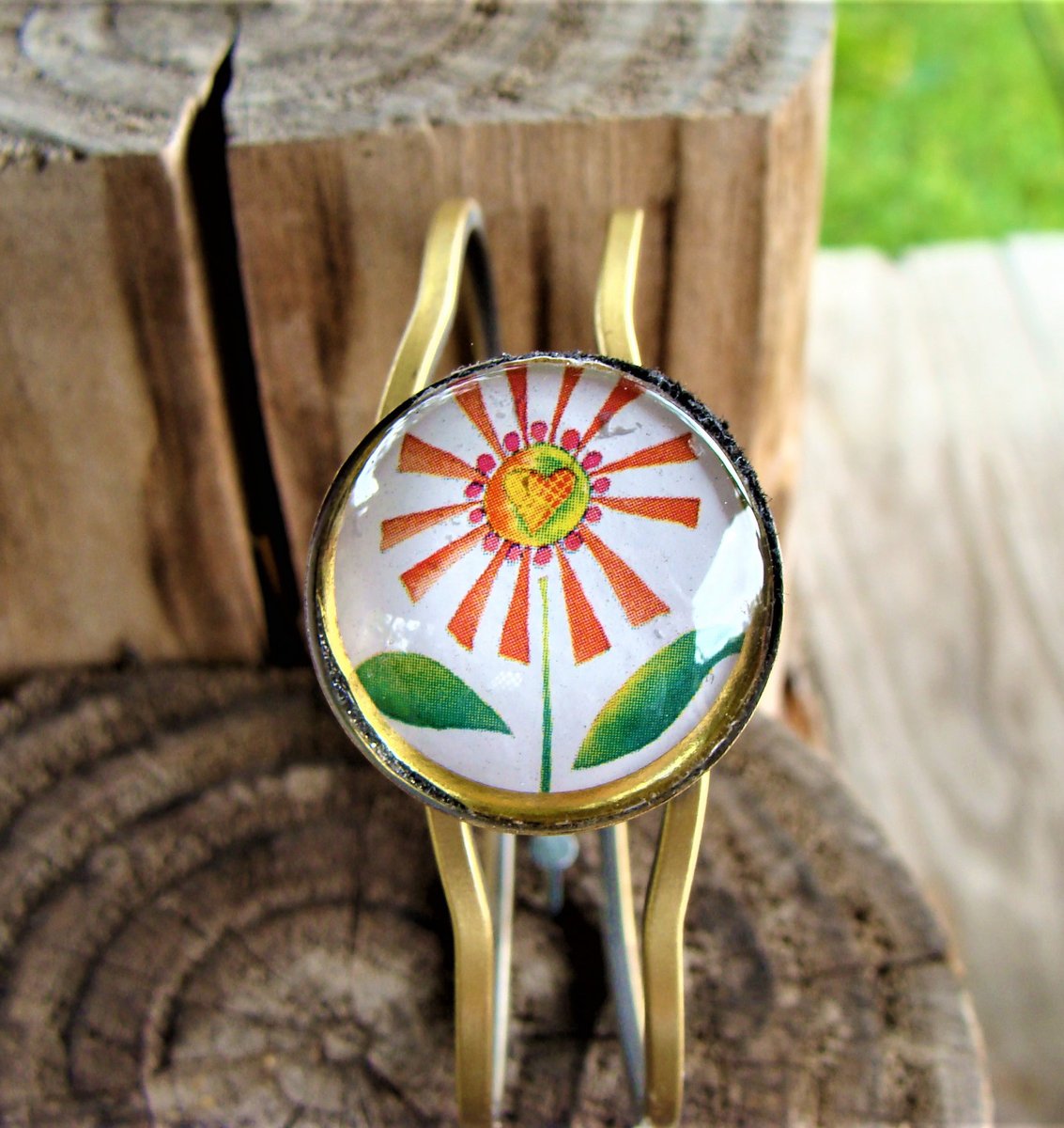 Orange Daisy Flower Print Cabochon on Antique Gold Hinged Pull Apart Bracelet: etsy.com/listing/811326… #orangedaisy #daisyprint #daisybracelet #daisyjewelry #antiquegoldbracelet #hingedbracelet #glasscabochon #boho #hippie #summerfun #etsyhandmadejewelry #etsyseller #shopsmall