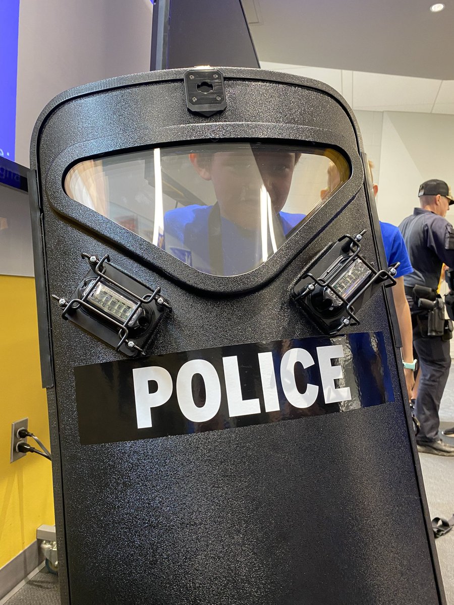 LawrenceKS_PD's tweet photo. Kiddos at Police Camp are learning that being a member of our Crisis Response Team can require some heavy lifting! https://t.co/LpTFltp6Oo