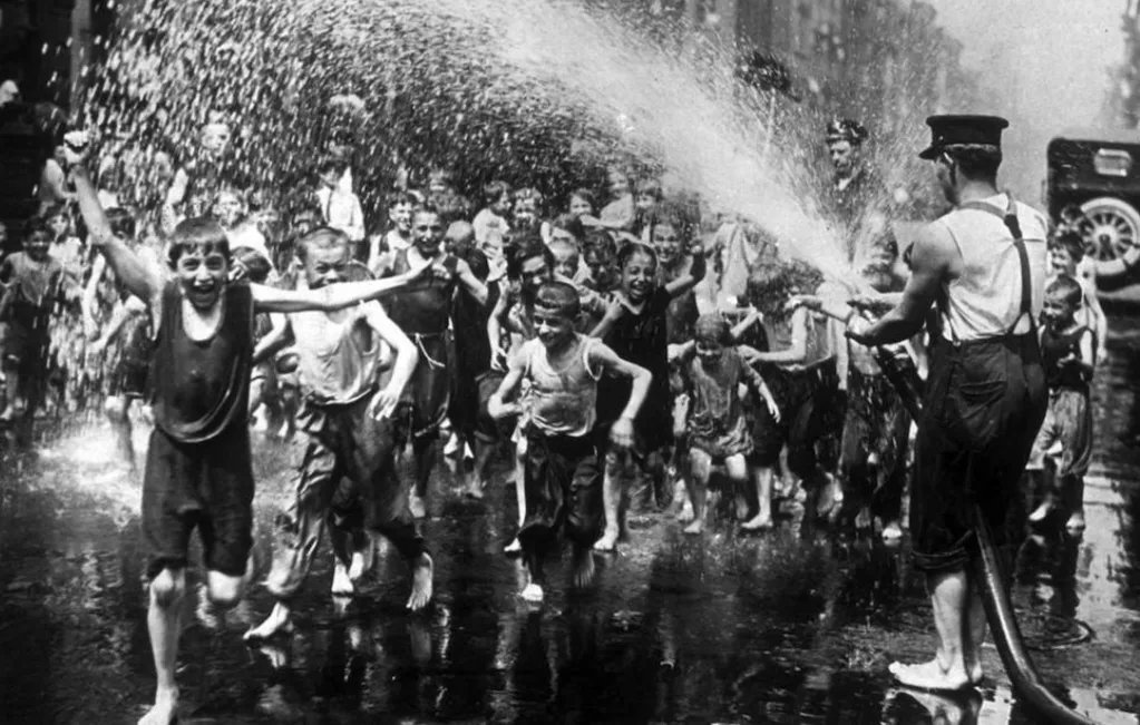 A group of London children having a hosedown during the heatwave in 1935