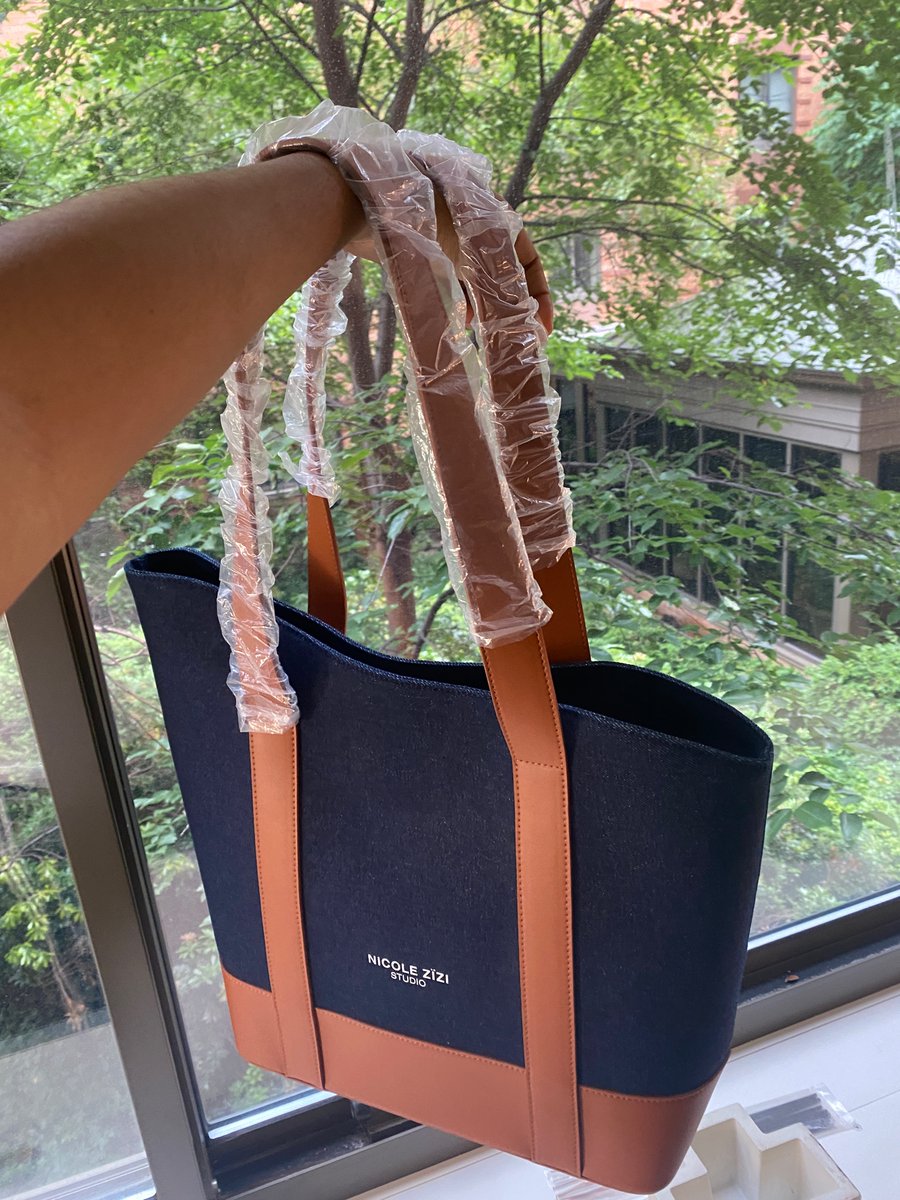 NicoleZizi's tweet photo. I was tired of drawing straight lines — asymmetrical tote bag  — denim and biobased leather https://t.co/poH9e4eyVQ