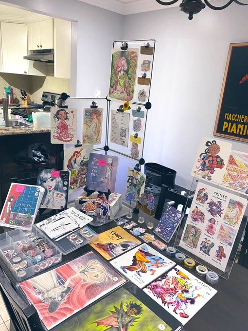 Here's my practice table set up to show you what I'll be bringing to TCAF this weekend! Get hype!!! Tons of comics and stickers and more - table 302 on the third floor 🕺🏽💃🏻 @TorontoComics 