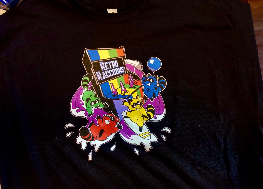 Here's a look at the new Retro Raccoons shirt - will have to bring some to events like <a href="/GameOnCleveland/">Cleveland Gaming Classic 🔜 Sept 11 - 13, 2026</a> for fans as a thank you for supporting this #indie #arcade. #cheers