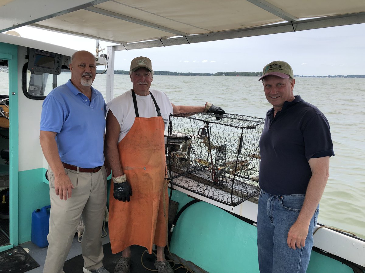 VaAgriculture's tweet photo. Commissioner Guthrie & Mike Hutt of @virginiaseafood met with Watermen JC Hudgins & Daniel Knott of the VA Waterman's Assoc. They spent the afternoon learning about the marine products industry and even went out to check on some crab pots! #VaAgWeek https://t.co/vJw2H9idnc