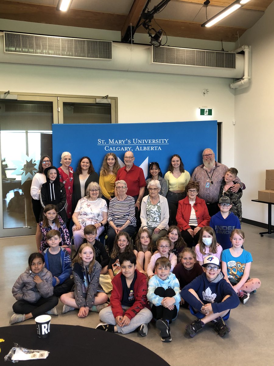 KiddleCBE's tweet photo. For over a year, some of our grade 4s have been forging intergenerational connections with seniors and undergrads from @StMarysUC. Today the published interviews and writings were unveiled when everyone met face to face for the first time. #weAreCBE https://t.co/2DTvTFLmWK