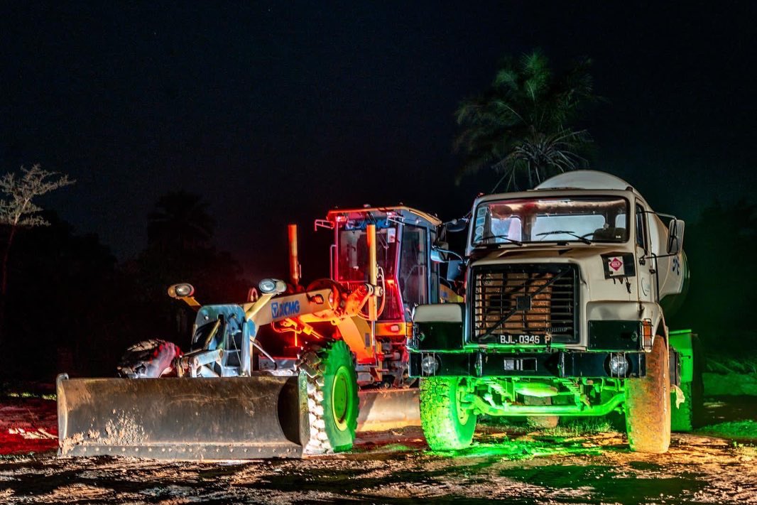 tafafricaglobal's tweet photo. As the sun sets tonight we Introduce the stars at TAF City:

1. The biggest Roundabout in The Gambia
2. The TAF Legacy Tree 
3. The construction trucks that keep the city growing; estate by estate
4. The TAFTukTuks that work all day and rest at night

Welcome to TAF City by night https://t.co/osLgI8wX1U