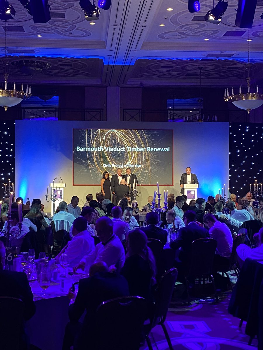 CEWales's tweet photo. The winner of the Civils Project of the Year #CEWAwards2022 is Barmouth Viaduct Timber Renewal, a second win this evening for @AlunGriffiths_ @networkrail congratulations to you all https://t.co/2UTpy1F5Hy