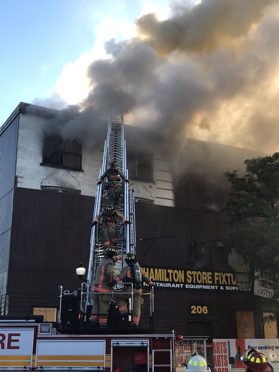 Our crews are working at a multiple alarm structure fire at 206 King St. W. Large vacant building well involved. Crews will be on scene for some time.