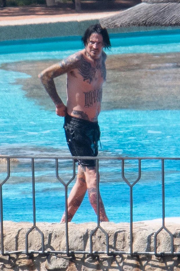 Tommy Lee Goes For A Shirtless Swim After Breaking Ribs &amp; Quitting Motley Crue Tour.