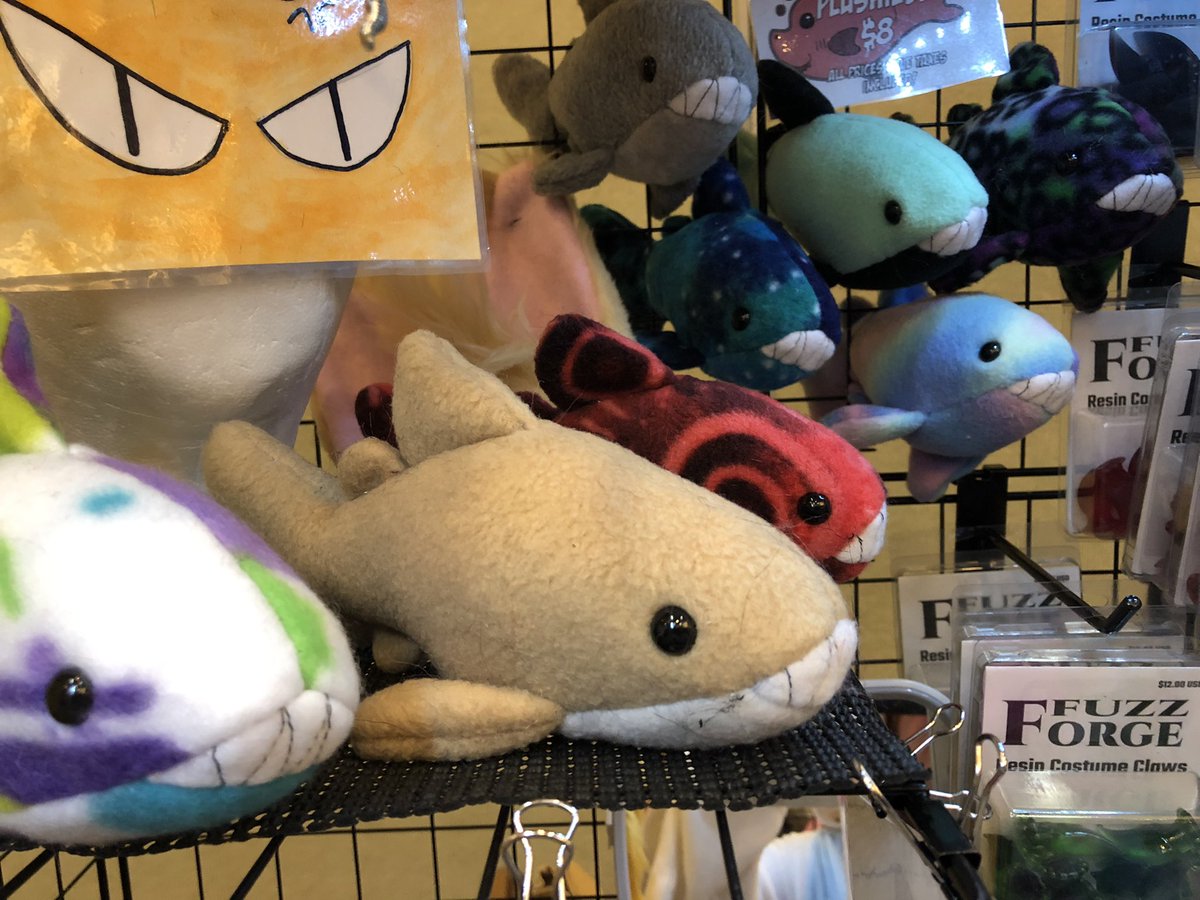 OurMassHysteria's tweet photo. We are open at #cosplacon !  We still have a nice selection of paws and a small school of plushie sharks looking for a home. Stop by and see us! https://t.co/PI6pKUInpL