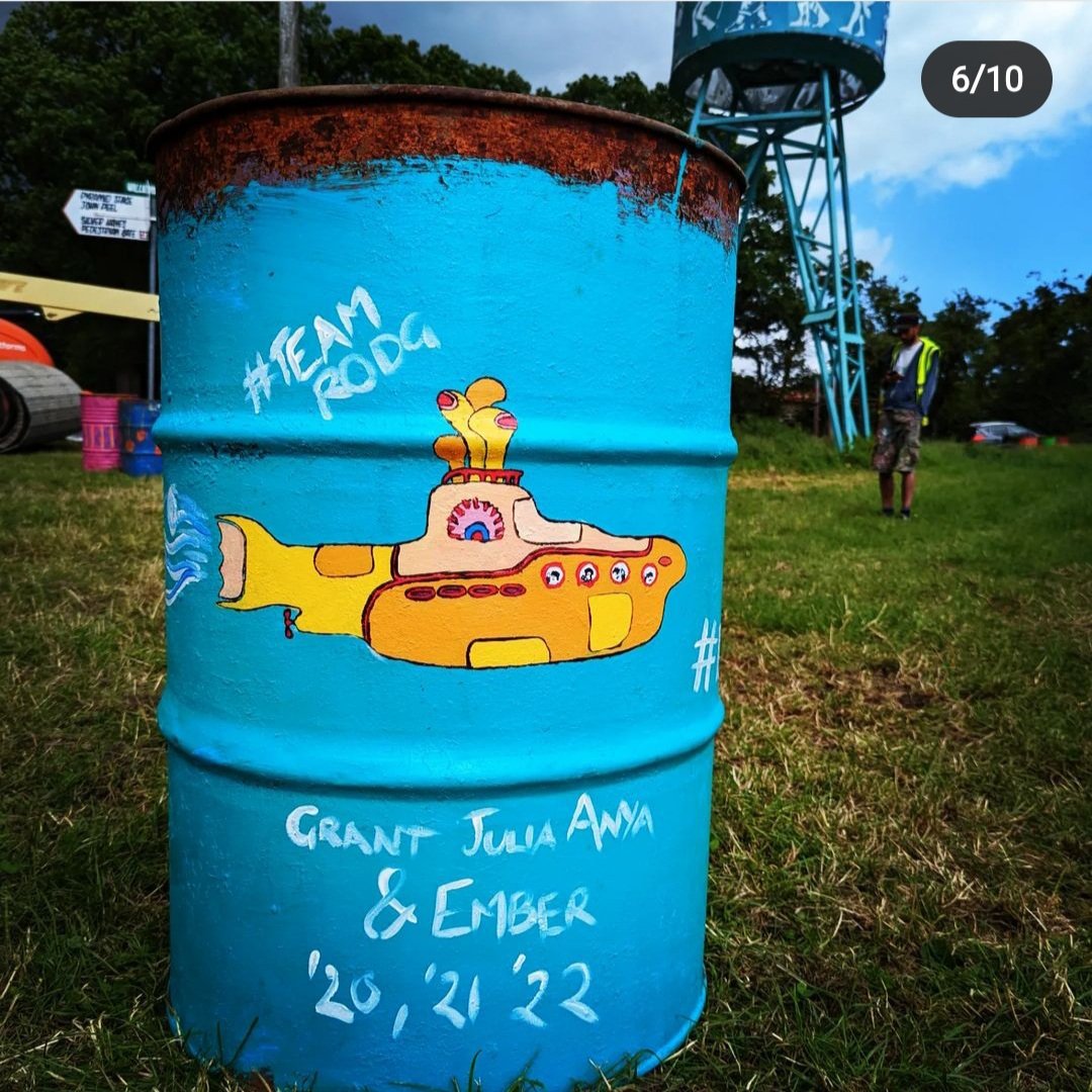 ruthmcnab's tweet photo. It's been a hot couple of weeks painting bins in the beautiful @glastonbury fields. I think this is one of the ones I enjoyed the most :). The Beatles' Yellow Submarine for #teamRodg Four days till it all kicks off. The site is looking amazing #glastonbury22 #charitybins https://t.co/9vPMeyyNGS