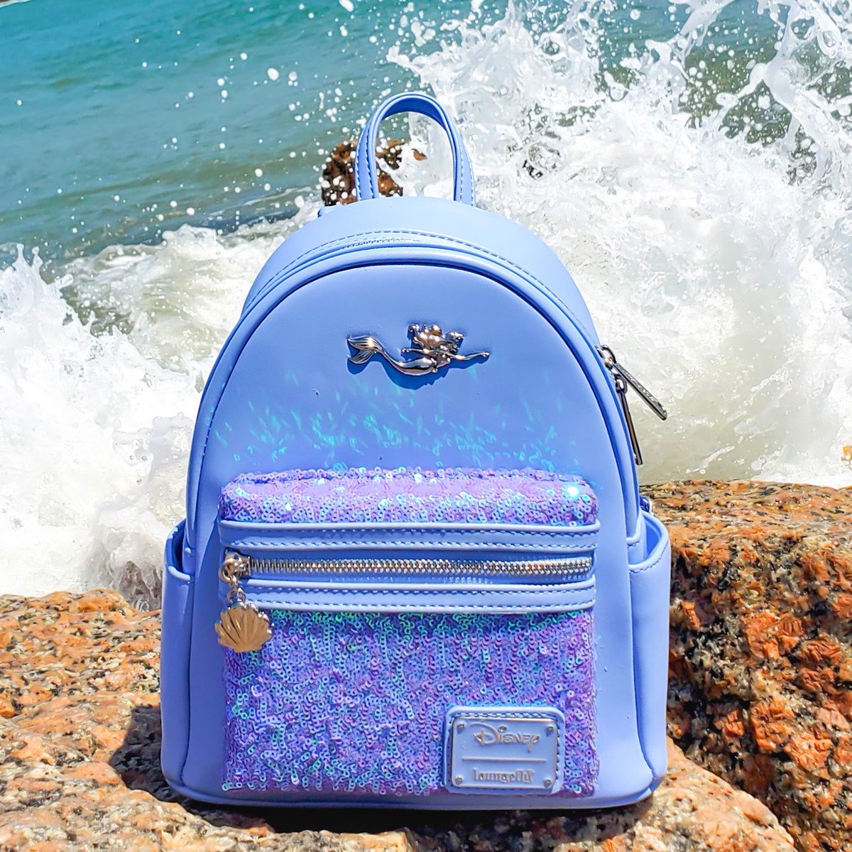 Loungefly's tweet photo. A splashing new #DisneyPrincessStyle has washed ashore! π§ββοΈππ
π: Available Monday, 6/20 at 4pm PST exclusively at @undertheseaco! https://t.co/avb7P6dkbw