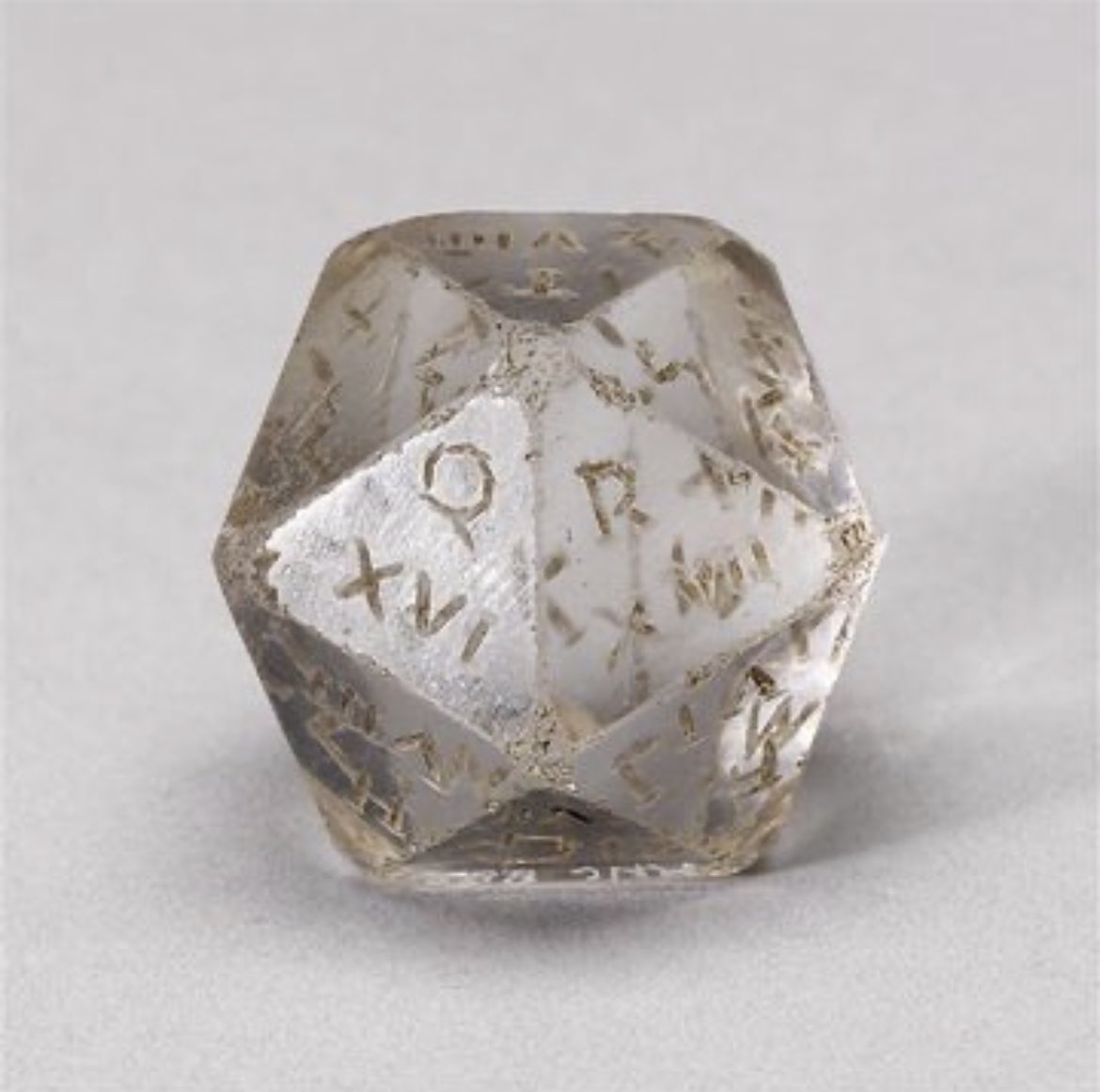 BugbearBrothers's tweet image. A 1cm high, rock crystal D20 from the Roman Empire that sits at the Louvre. 
Each face has a Latin letter, and its Roman numeral. These were thought to have been used in conjunction with divination handbooks. Those crazy grognards!
#d20 #dicegoblin #dnddice