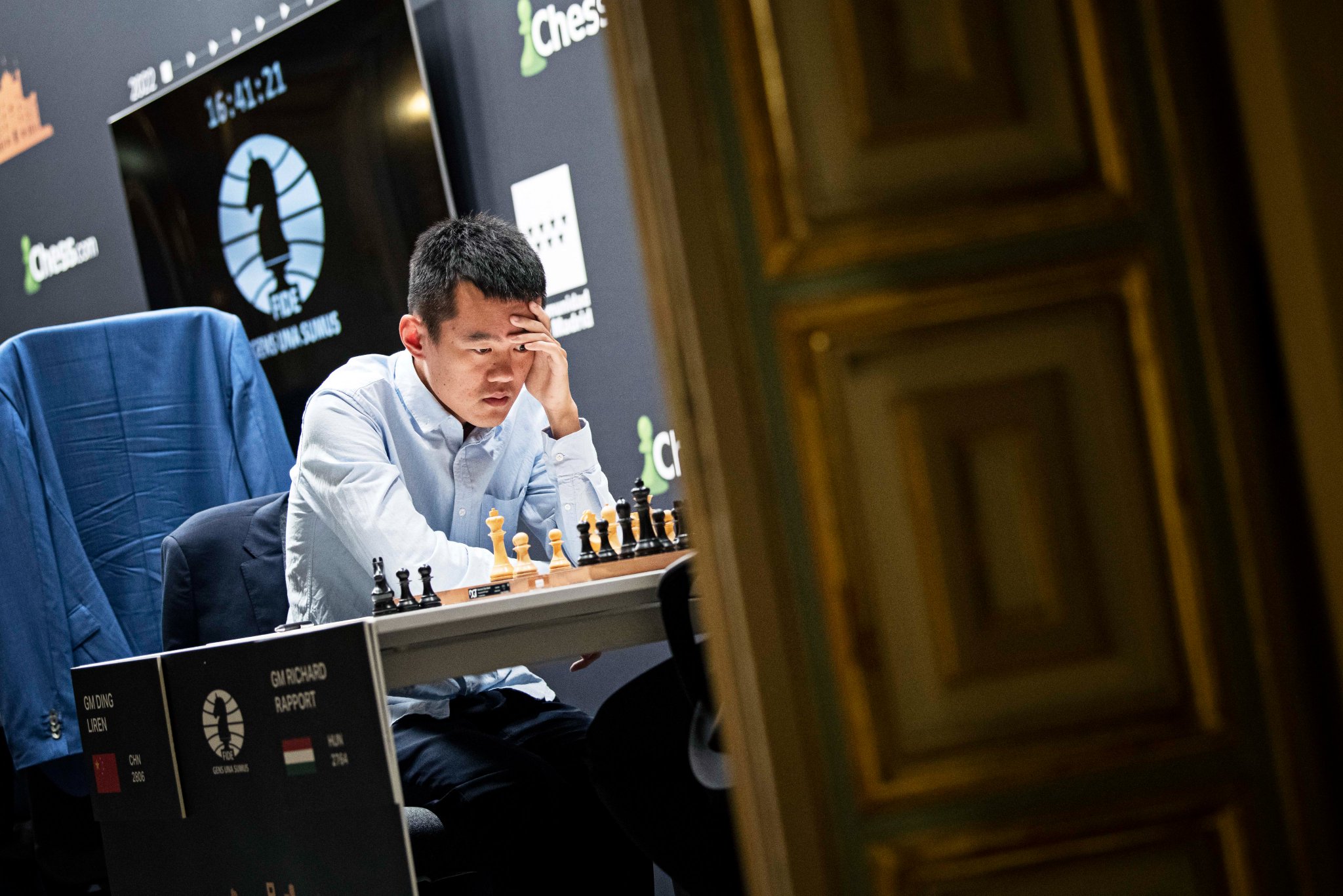 Ding embraced by his second Richard Rapport after his first ever world  championship victory : r/chess