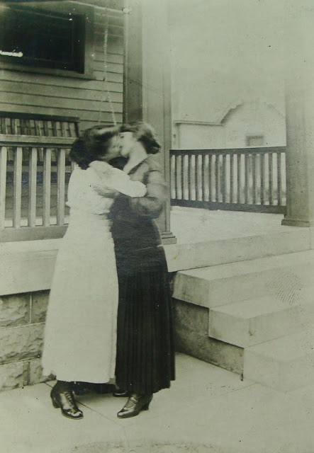 A kiss between two women. Photographed in the 1910s.