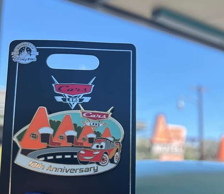 MouseWait's tweet photo. Cars Land 10th anniversary pin features Lightning McQueen driving by Cozy Cone. pc GrumpyPirateDad #mousewait #disneyland #disneycaliforniaadventure #carsland #radiatorsprings #pins #10thanniversary https://t.co/hUDRvmherP https://t.co/92fdRcI26o