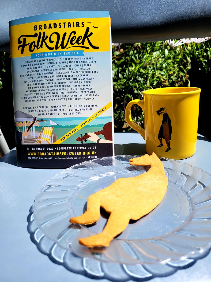 Welcoming our 2022 Souvenir Programme to the office, with a coffee and a Hooden Horse biscuit.  Order yours today via: broadstairsfolkweek.org.uk/.../souvenir-p…