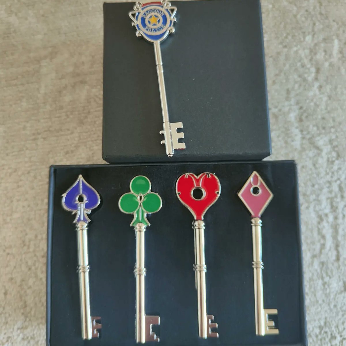 rainbow_geisha's tweet photo. Ooooo my resident evil keys arrived! My mate bought me the RPD one and I got the rest. Going to use them in the Res 2 board game! #residentevil2 #residentevil #boardgames #gamer #tabletop #res2 #keys #rpd #racooncitypolicedepartment https://t.co/Uq0PJoNs1L