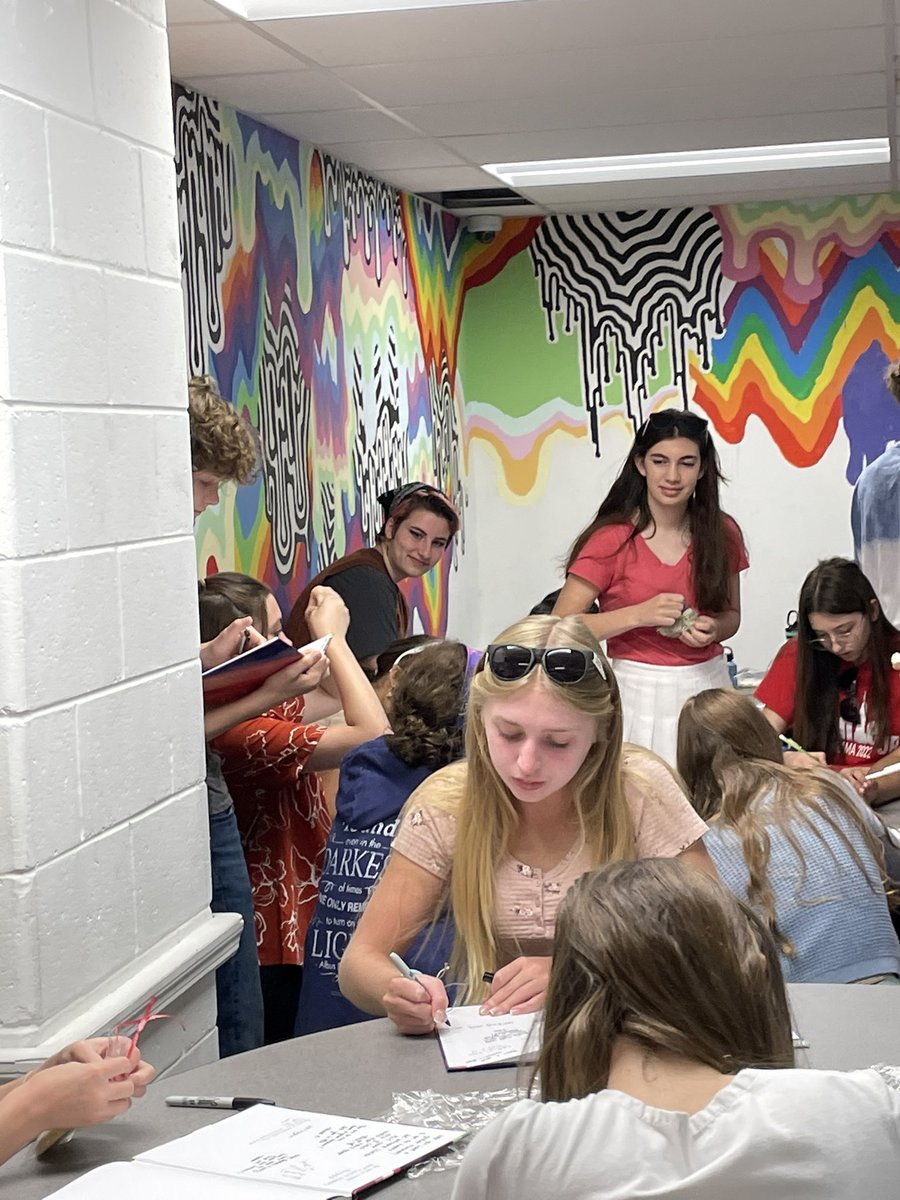 Our 8th graders: signing yearbooks with their classmates!