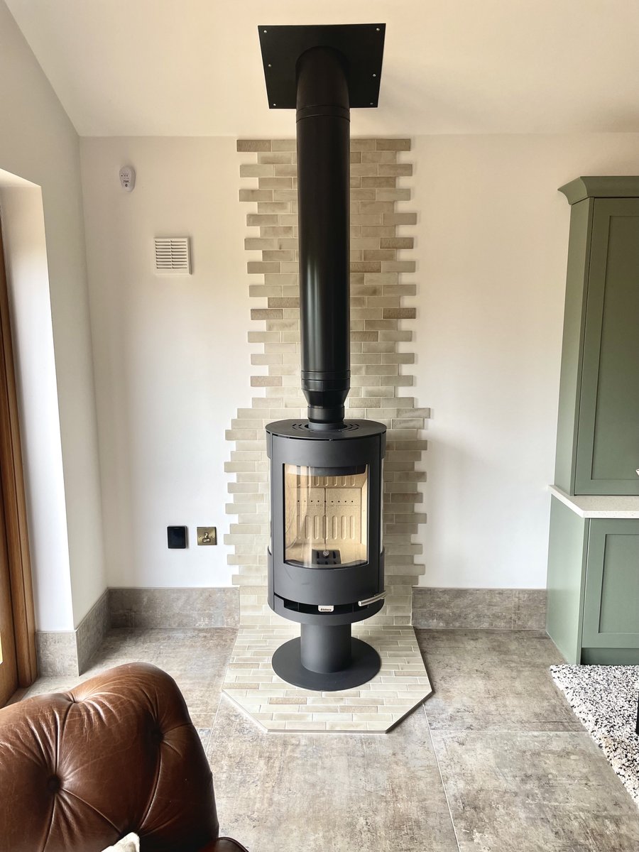 Tiles are a fantastic option for creating unique features within the home. A staggered brick effect has been used to turn this fireplace into a real focal point for the room!
