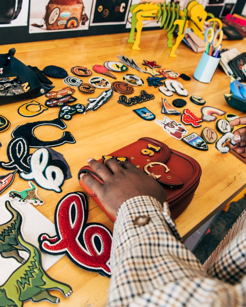 Coach's tweet photo. To the lab! ✂️ Come visit our #CoachReLoved and Repair Workshop with creators @macyeleni @iamowencain and @gbrinkly—who, together with our craftspeople, designed their own Upcrafted bags. (Some things are better the second time around.) https://t.co/iSD4cYurW6 #CoachNY https://t.co/F0Uie0tkTF