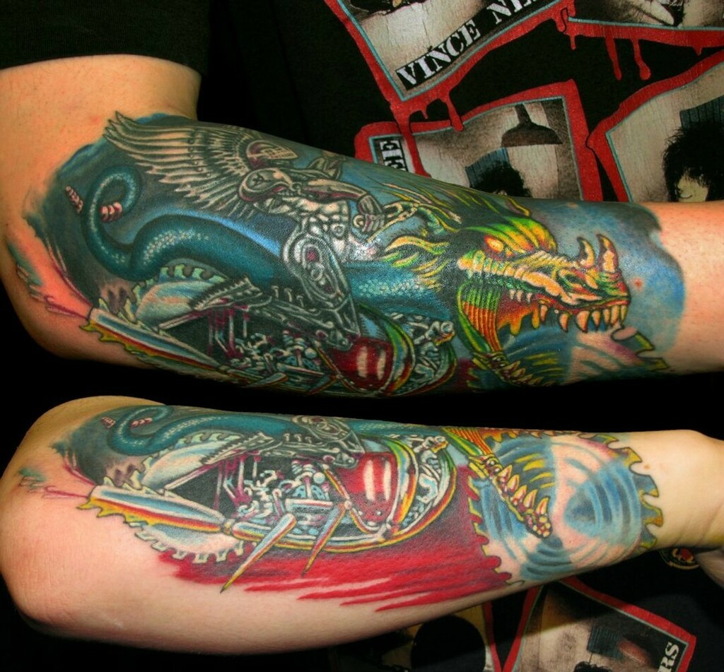 522Tattoo's tweet photo. A super kick ass forearm piece done by Ben! 
Love how the chrome looks shiny, while the dragon looks so colorful and bad-ass, who wants a ride?

@ben_there_tattoos 

#forearmtattoo #colortattoo #seattletattoo #dragontattoo #motorcycletattoo #custombike #chrome #pnwtattoo #52… https://t.co/lklLPJQzdK