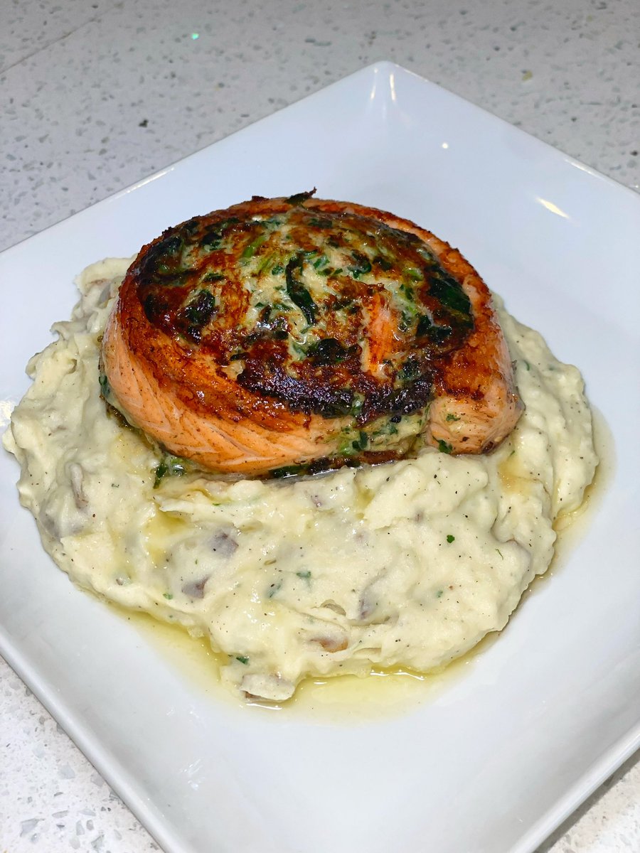 Salmon Pinwheel Stuffed With Spinach & Crab Meat Served Over Garlic Mashed Potato’s