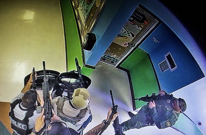 Law enforcement officers are shown on video inside Uvalde’s Robb Elementary at 12:04 p.m. May 24. They have guns and shields. But police did not enter the classroom where the shooter was for another 46 minutes.