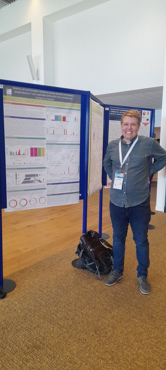 EmmaBeansworth's tweet photo. In these poster session today see Samuel Bloomfield, my @TheQuadram neighbour, &amp; @ae_mather postdoc discuss his @MicrobioSoc #genomics paper. It uses #Socru to hint at the impact of #genomerearrangement has on invasive non-typhi #salmonella #iNTS infections with mobile #AMR genes https://t.co/iIGGvnin6Q