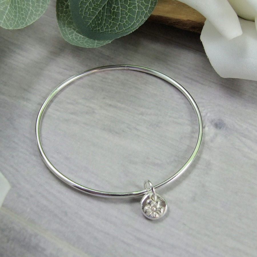 MaxinePring's tweet photo. Sterling Silver Bangle with Flower Charm. Recyc... - Folksy https://t.co/LNfJ9rakrV #charmbangle #newonfolksy #handmade https://t.co/GP5Pdcd1ld