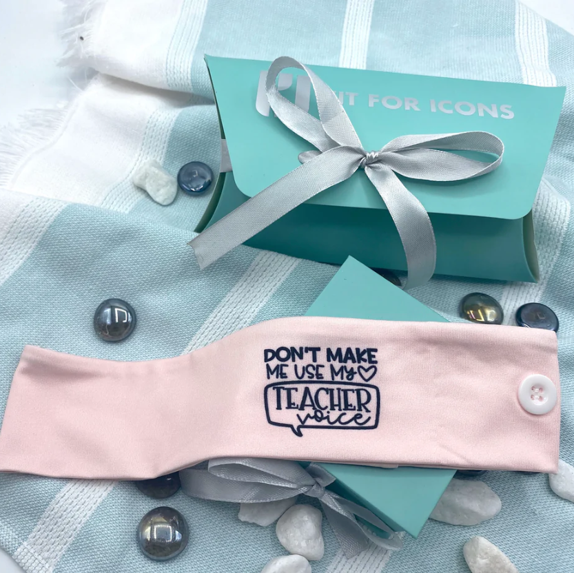 Need somewhere to clip your mask? 💫 Protect ear chafing with our wide "Don't Make Me Use My Teacher Voice" Logo design headband ✨

Shop gifts, scrubs and more on our website 🌟 
fitforicons.com 📲

#fitforicons #fitforhumankind #giftsforicons #keyworkerlife