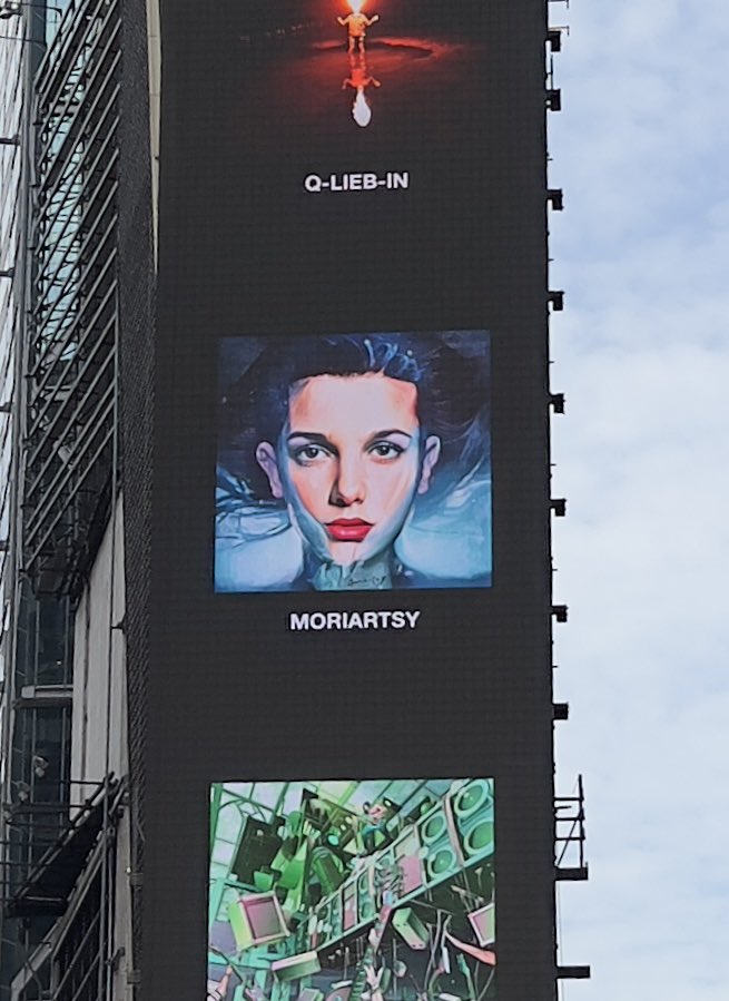 ARICKartist's tweet photo. My 15sec of #Fame! Super honored and excited to see my artwork called “Living in an Upside Down World” on the big screen in #NYTimesSquare so incredible! Thank you @NFT_NYC #nftcommunity #nftartist #nftfineart #fineart #nftart https://t.co/uuHFiXCKao