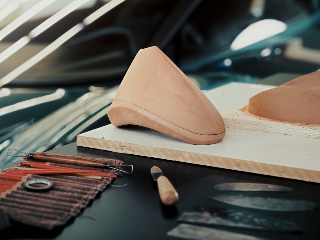 bowmore's tweet photo. Did you know: Clay sculpting remains an integral part of the design process at @astonmartin.
Go behind the scenes here: https://t.co/ZdvhKYlWrc #Bowmore #BowmorexAstonMartin #ARC52 https://t.co/rhDb04JwvW