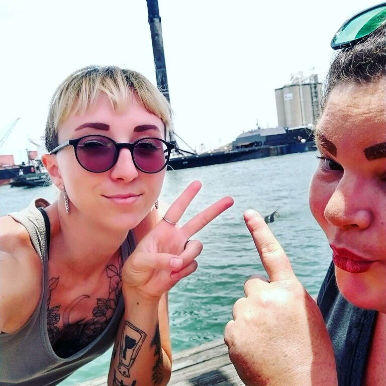 RustysInThePort's tweet photo. Day girls welcoming the booster back to the harbor this morning with a quick photo bomb... at Rusty's at the Port!!!😎👍🚢🚀🛰🐬#boostersback #boosterreturn #daygirls #photobomb #launchshift #lunchshift #rustysfam #rustyspeeps #rustysseafood #portcanaveral https://t.co/8uPzyVW4ho