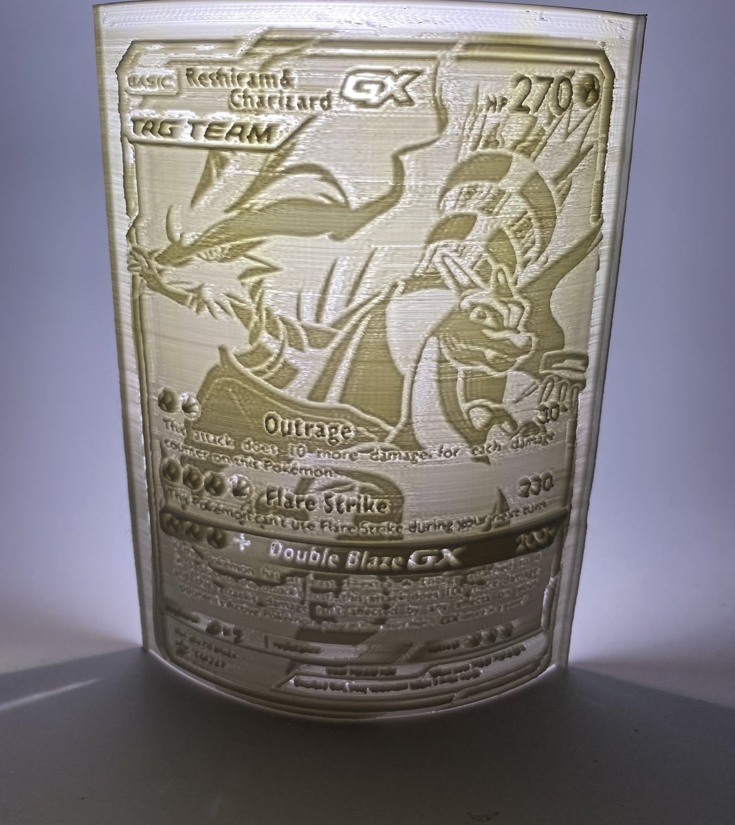 SirTanninator's tweet photo. I recently opened up a #charizard #PokemonTCG box I found at Walmart that had a promo card inside. A friend of mine ended up liking the card so I #3dprinted a #lithophane of the card to send to him. https://t.co/7QBUb5gmNw