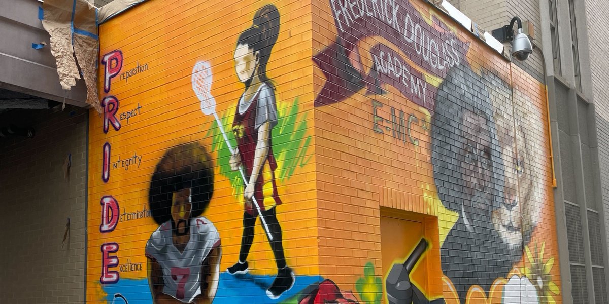 Check out this amazing mural outside of FDA!
'It's so wonderful to see the impact girl's lacrosse has had in this school community over the years. We have a lax girl up there with Frederick Douglas, Colin Kaepernick & of course our school mascot.' -Coach Tash