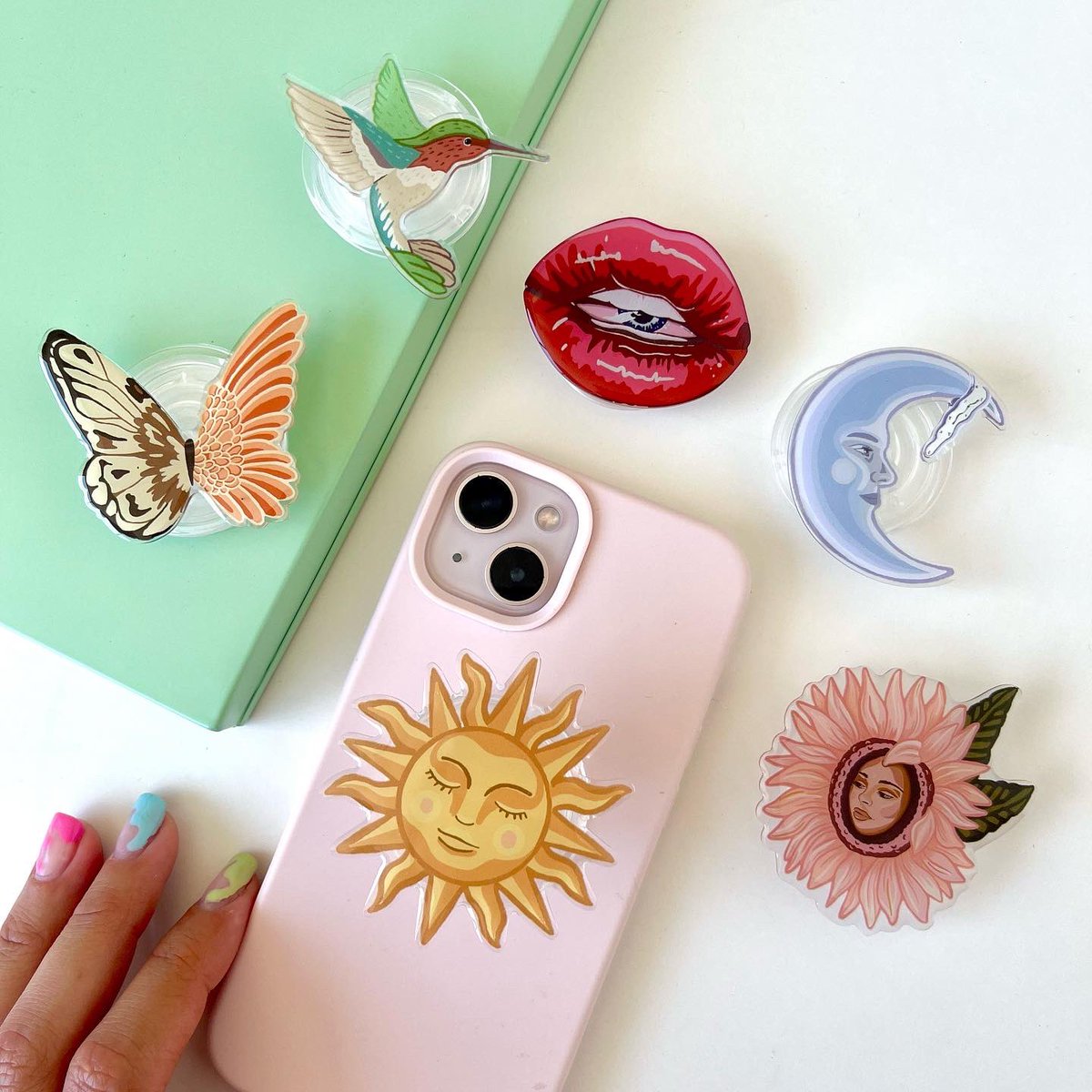 i made phone grips with my art!!! 🥹