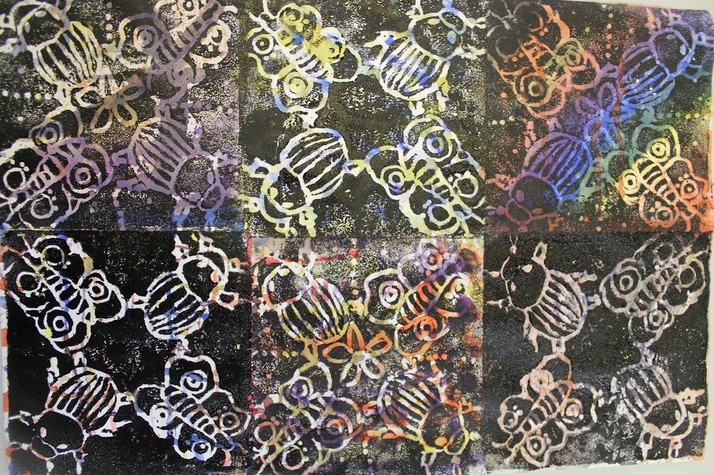 Year 8 Art have been making poly-prints (theme - insects) using symmetry on watercolour backgrounds.