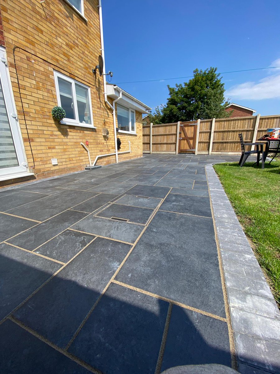 Grosvenorgrass's tweet photo. Patio and Path's finished a few weeks ago in Belton, Norfolk after dodging heavy showers for two weeks 🌧

These Brazilian Black Charcoal Slate Tiles, with charcoal block edging look stunning 😍 https://t.co/MIyNBJrEfJ