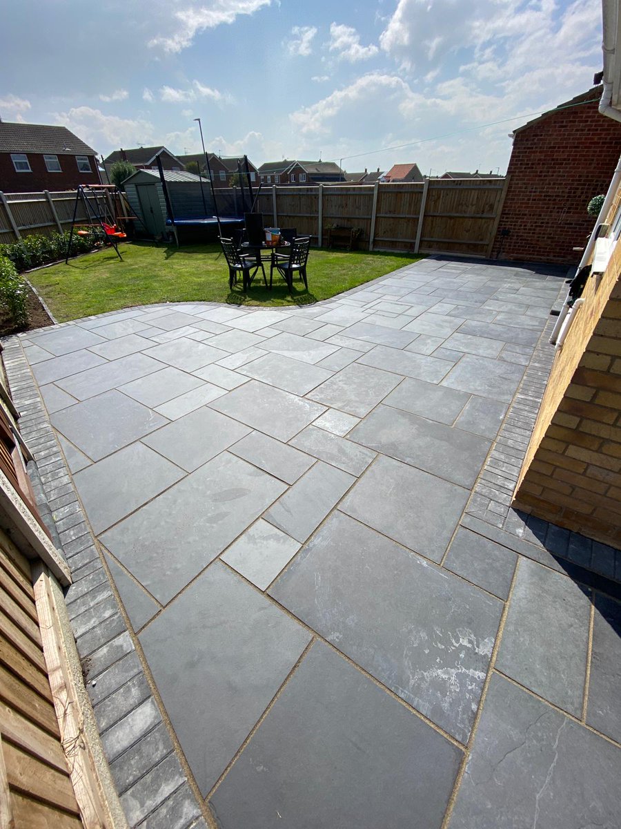 Grosvenorgrass's tweet photo. Patio and Path's finished a few weeks ago in Belton, Norfolk after dodging heavy showers for two weeks 🌧

These Brazilian Black Charcoal Slate Tiles, with charcoal block edging look stunning 😍 https://t.co/MIyNBJrEfJ