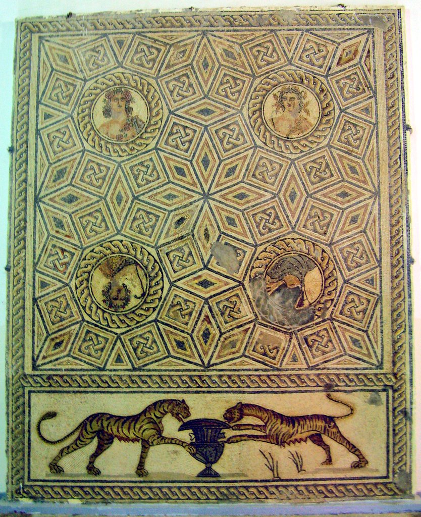 romanarchaeouk's tweet image. The display of mosaics when ARA&apos;s study tour visited the museum at Ptolomais, Libya, included several Bacchic mosaics, including one with the four seasons and big cats either side of a cantharus, and a marvellously detailed birds fragment #MosaicMonday