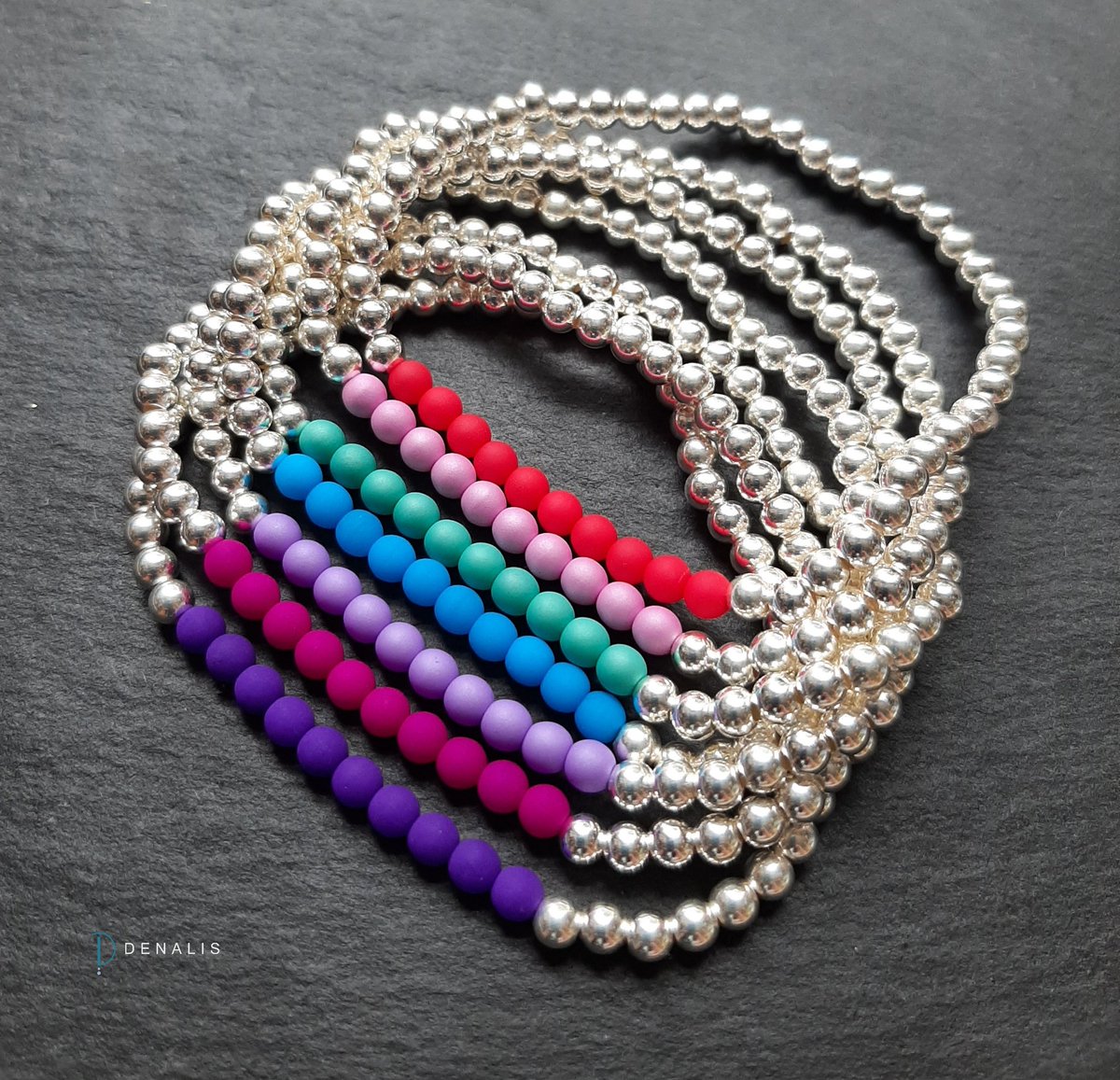 Continuing the neon theme, introducing my new Hana bracelets.
Striking and bright, these sterling silver bracelets feature a section of 4mm glass Czech neon beads.
They can be worn alone or stacked with others.
Stretch bracelets can be gently rolled on and off, no fiddly clasps.