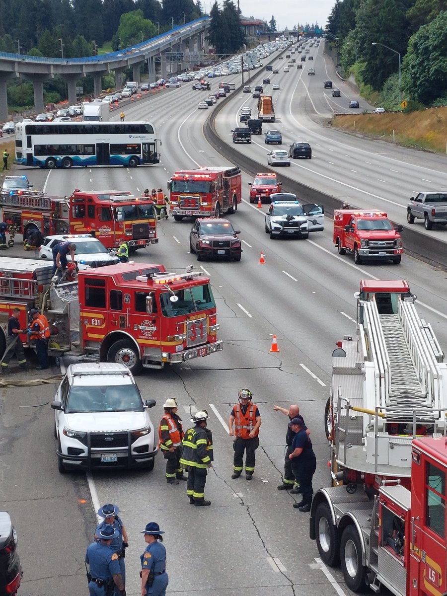 chrisreadwriter's tweet photo. North bound i-5 approaching N 145th St, Seattle, completely blocked. Collision with car upside down. July 4, 2022, 11am hour. https://t.co/IVDZYsFjVI