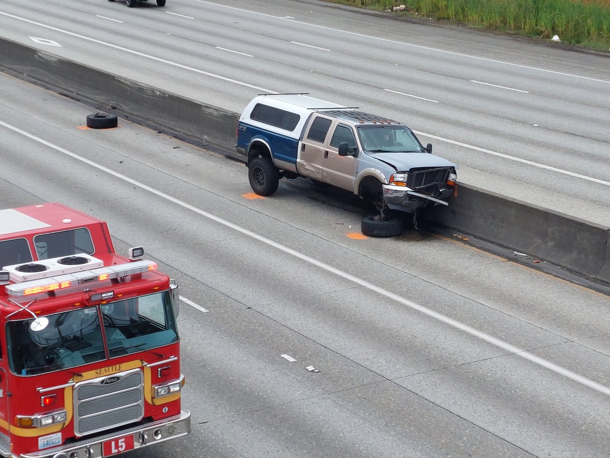chrisreadwriter's tweet photo. North bound i-5 approaching N 145th St, Seattle, completely blocked. Collision with car upside down. July 4, 2022, 11am hour. Involved truck. https://t.co/jTnEEEAU71