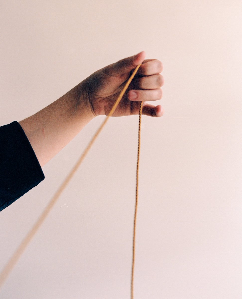 In the studio, working with silk military cord to embellish one of the pieces in the #KindredQueens collection. #12women #bulleproof #kevlar #girlsincdc