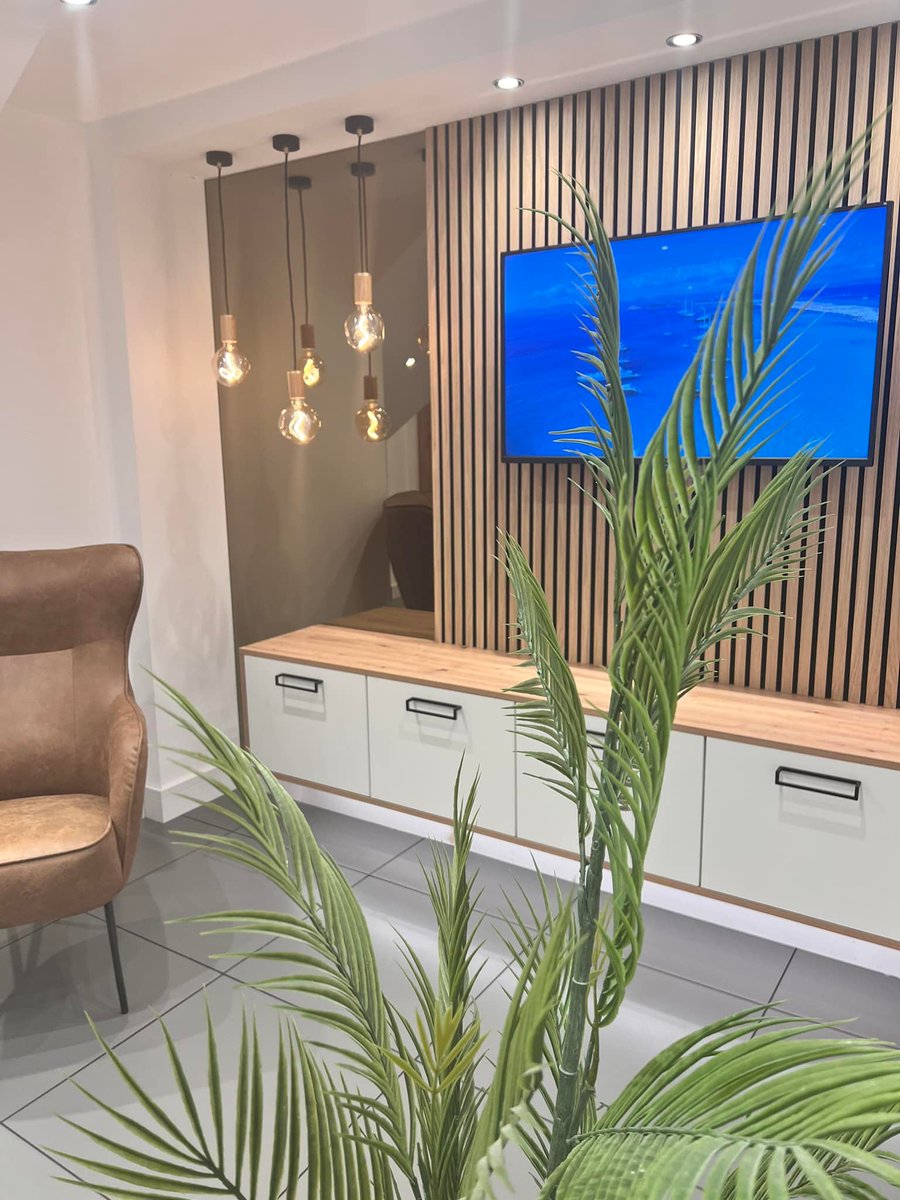 Time to Chill This tv area Is the perfect place to unwind for the weekend. Our stunning bespoke lighting and mirror can be viewed in our Kilmarnock Studio. What do you think ? #kitchenstudio #kitchendesign #kitcheninstall #tvarea #kitchenstyle #kitchenideas #kitchensbyjsgeddes