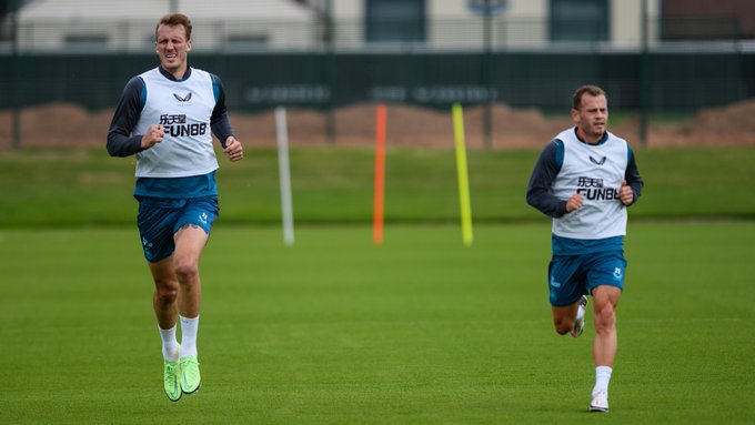 Dan Burn and Ryan Fraser running alongside each other in pre-season training