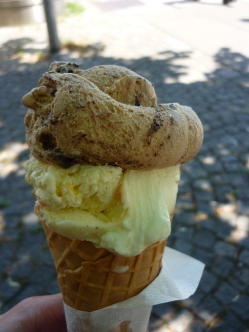 An ice cream cone with three varieties.