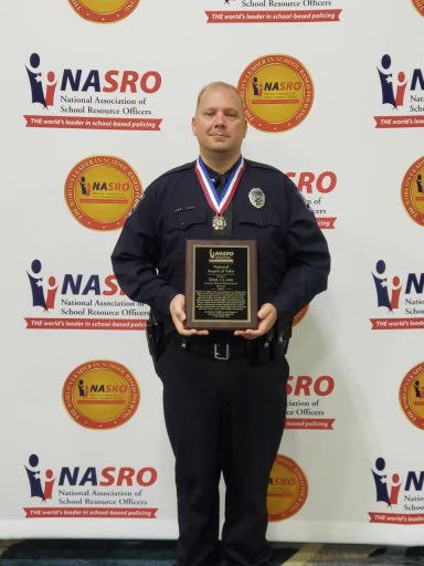 OlathePolice's tweet image. Congratulations to Officer Erik Clark who received the National Award of Valor from the National Association of School Resource Officers last night in Aurora, Colorado.