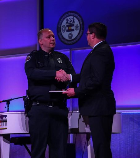 OlathePolice's tweet image. Congratulations to Officer Erik Clark who received the National Award of Valor from the National Association of School Resource Officers last night in Aurora, Colorado.