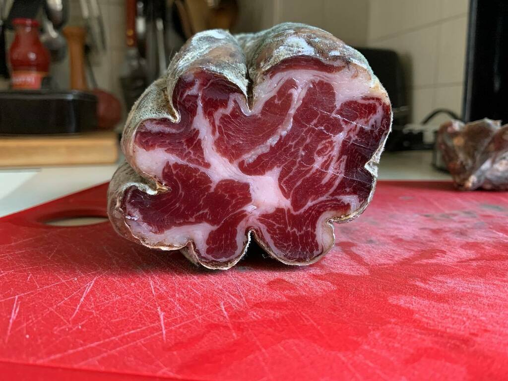 My first foray into salumi making, Coppa Piacentina!  Seven days curing in salt, then 90 days in a cool retro looking mini fridge I outfitted to keep the temperature at 55° F  and the humidity around 80%. The ultimate low and slow! instagr.am/p/CfoxfWvOuJ3/